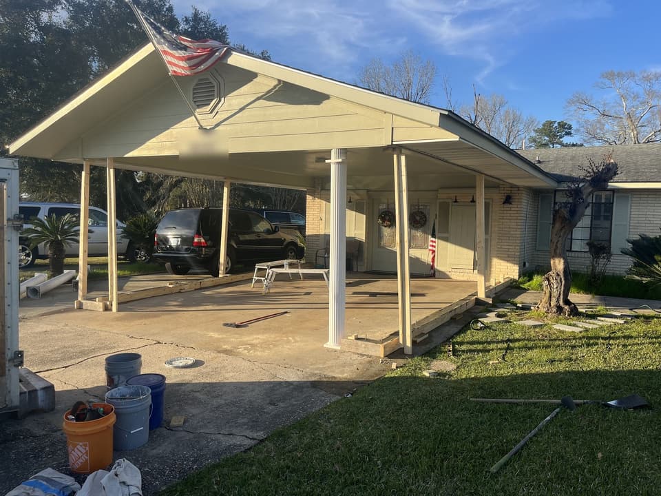 Open carport on the front of a house before it was enclosed