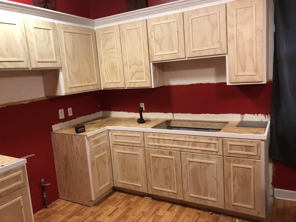 New raised-panel kitchen cabinets installed before countertops