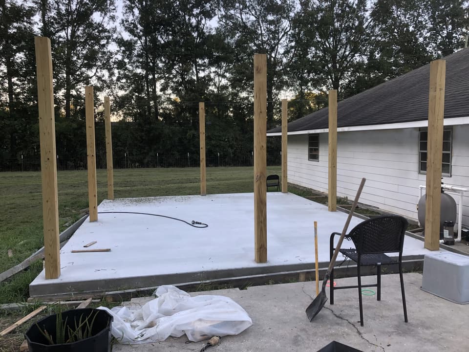 Pavilion posts set on a new slab, before framing the roof